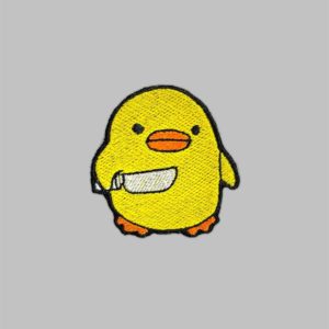 Duck Holding Knife Patch. Iron on embroidery patch of a duck holding a knife.