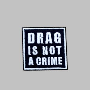 Drag is not a crime embroidery patch. Iron on embroidery Patch. white thread against black fabric.