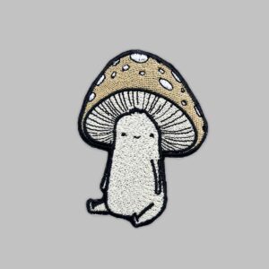Mushroom Guy Patch. Embroidery patch of a tan colored mushroom friend sitting down